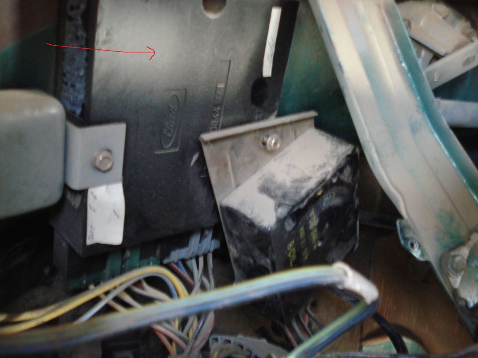 Close-up of a Ford electronic control unit with wiring harness