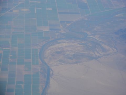 1989 Ford Taurus - An aerial perspective captures the contrast between a meandering river and organized farmland.