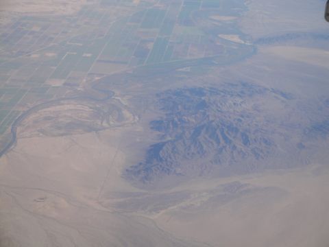 1989 Ford Taurus - An aerial perspective captures the contrast between cultivated land and natural desert terrain.