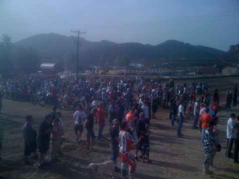 1968 Ford Mustang - A large gathering of people and motorcycles at an outdoor event.