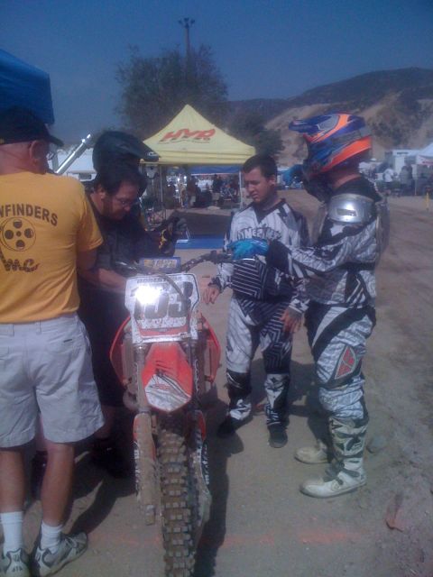 1968 Ford Mustang - Motocross riders and a dirt bike with number 33 are seen at an outdoor event.