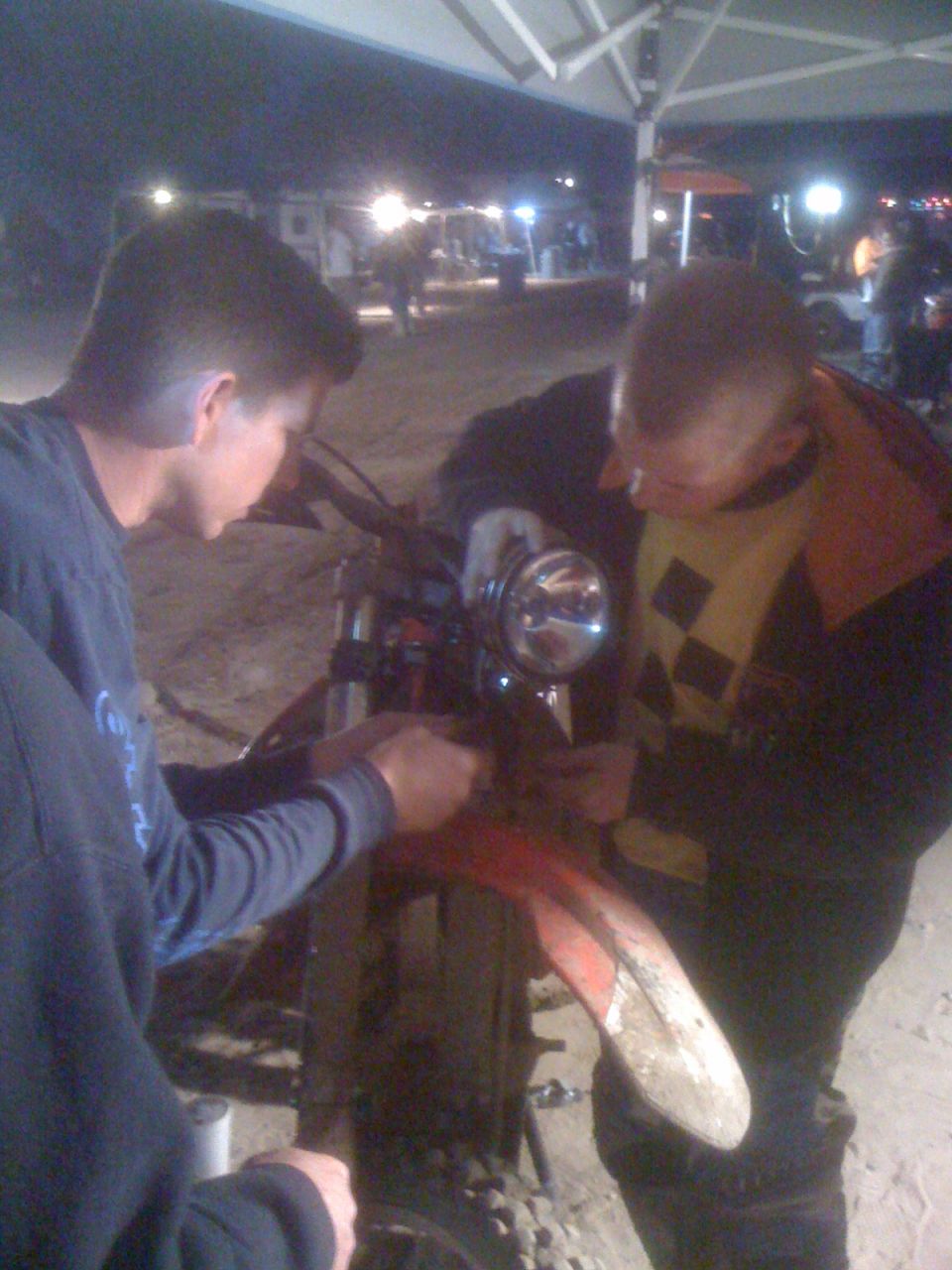 Motorcycle front fender and headlight assembly being worked on