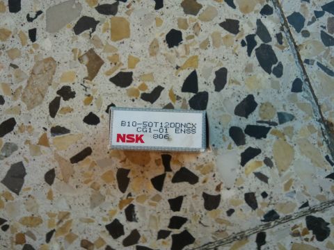 1998 Ford Crown Victoria - Box for an NSK bearing is shown on a speckled floor.