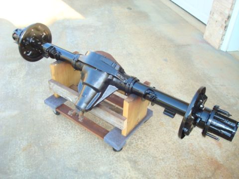 1995 Ford Bronco - Rear axle assembly, likely from a Ford truck or SUV, displayed on a wooden stand.