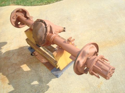 1995 Ford Bronco - A rear axle assembly, possibly for a truck or SUV, is shown resting on wooden supports.