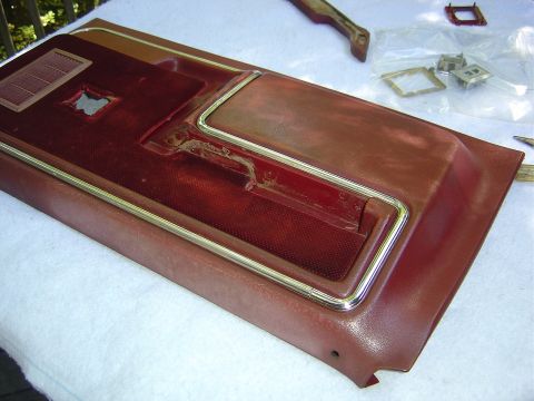 1986 Ford Bronco - When you flip the door over the armrest pad should fall off, the cloth covered section may as well. If not, it should lift off easily.