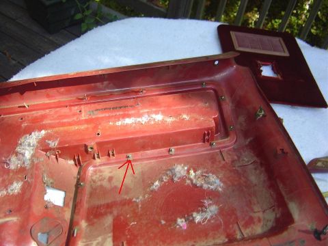 1986 Ford Bronco - This is the final type of tab holding the chrome trim ring in place. Just remove the lock the same way you did the other kind.