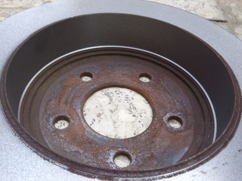 1998 Ford Crown Victoria - A close-up view of a heavily rusted brake rotor, with a watermark for Supermotors.net visible in the lower right corner.