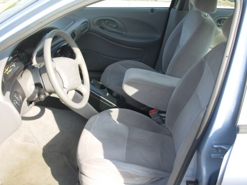 1997 Ford Taurus - Interior view of a 1997 Ford Taurus, highlighting the front seating area and controls.