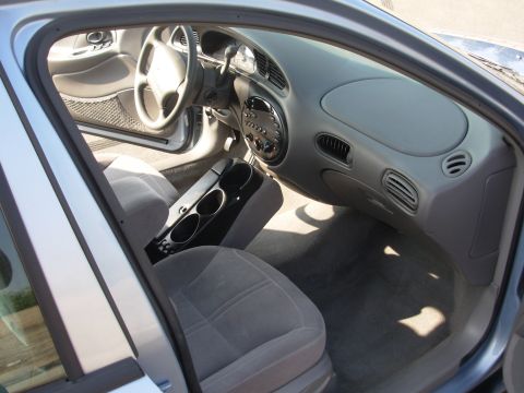 1997 Ford Taurus - Interior view of a 1997 Ford Taurus, highlighting the dashboard and seating.