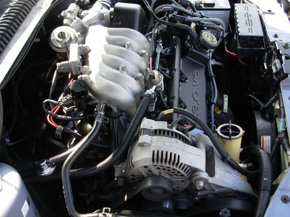 Ford 3.0L V6 engine bay showing intake manifold and alternator
