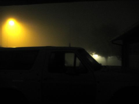 1996 Ford Bronco - Side view of a 1996 Ford Bronco parked at night under a street light.