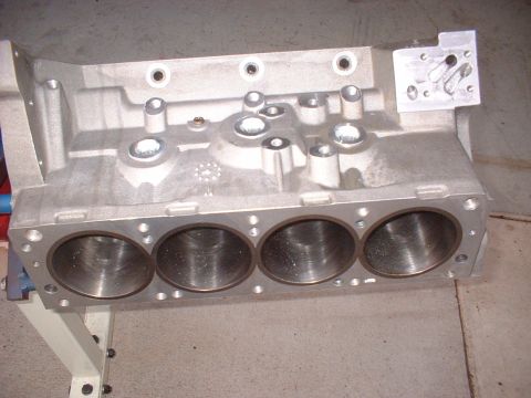 1965 Shelby Cobra - Close-up of an aluminum V8 engine block, showing the cylinder bores and mounting points.