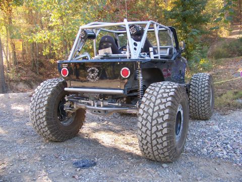 1992 Jeep YJ - This heavily modified Jeep Wrangler features a custom roll cage and oversized tires, ready for off-road adventures.