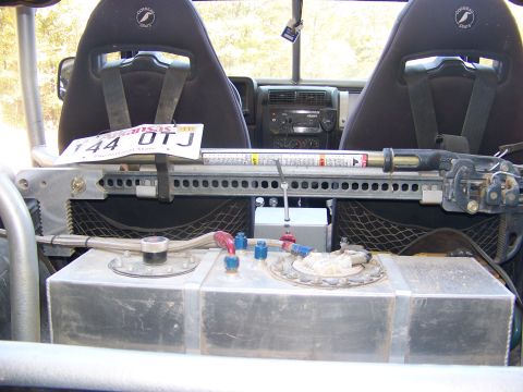 1992 Jeep YJ - Customized Jeep interior shows racing seats, auxiliary fuel tank, and mounted jack.