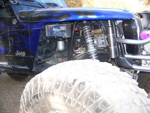 1992 Jeep YJ - Modified Jeep engine bay with custom paint and off-road components visible.