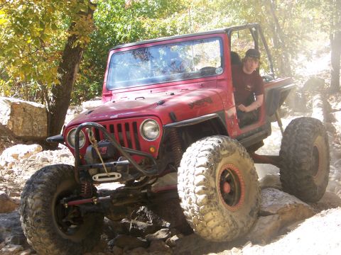 1992 Jeep YJ - This 1992 Jeep YJ is shown tackling a challenging rocky trail during an off-road excursion.