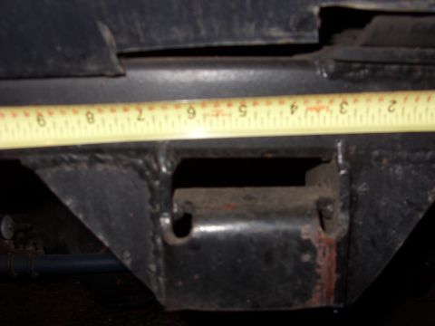 1988 Ford Bronco - Measuring tape on vehicle frame section.