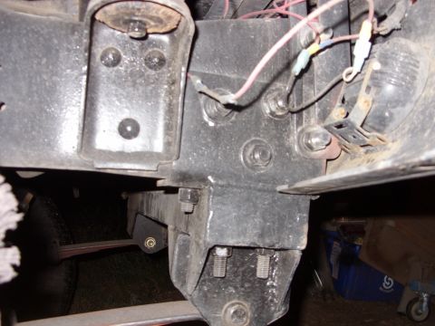 1988 Ford Bronco - This image shows a close-up view of the vehicle's undercarriage, focusing on suspension and frame components.