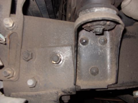 1988 Ford Bronco - Detail shot of vehicle chassis components, including frame and suspension parts.