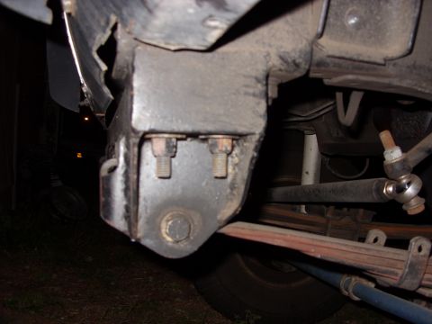 1988 Ford Bronco - Undercarriage view of a vehicle, focusing on the frame and suspension system components.