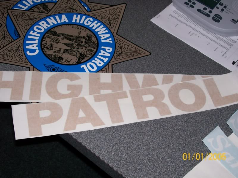 California Highway Patrol decals and badges on a grey surface