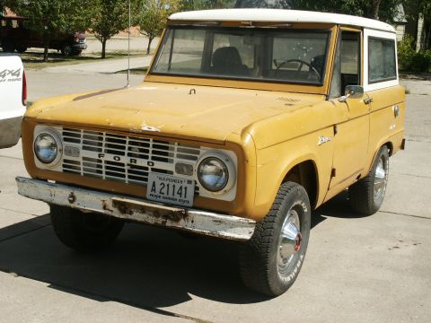 1966 Ford Bronco - 1966 Ford Bronco with a white roof and a license plate from Peace Garden State.