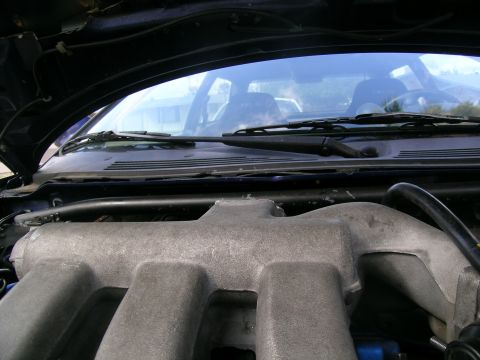 1995 Ford Probe - Engine intake manifold shown from under the hood of a vehicle.