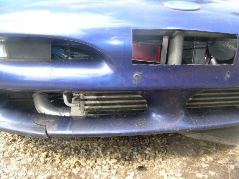 1995 Ford Probe - Custom intercooler setup visible behind the front bumper of a modified vehicle.