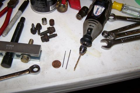 1996 Ford Bronco - The selection of tiny bits I used with the Dremel to drill the corrosion out between the bolt and the cover.