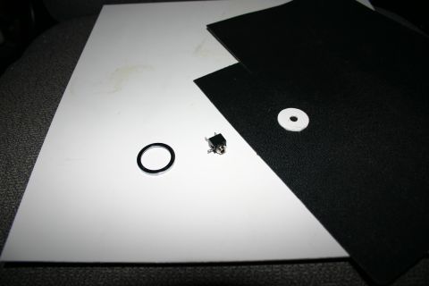 1995 Ford Bronco - Two types of plastic, audio jack, beauty ring from cigarette lighter, and rough cut piece for testing.