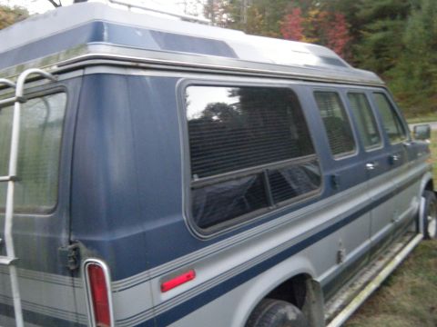 1981 Ford E350 - 1981 Ford E350 van, side view, showing two-tone paint and a rear ladder.