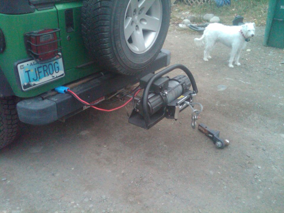 Green Jeep rear bumper with winch, spare tire, and TJFROG license plate