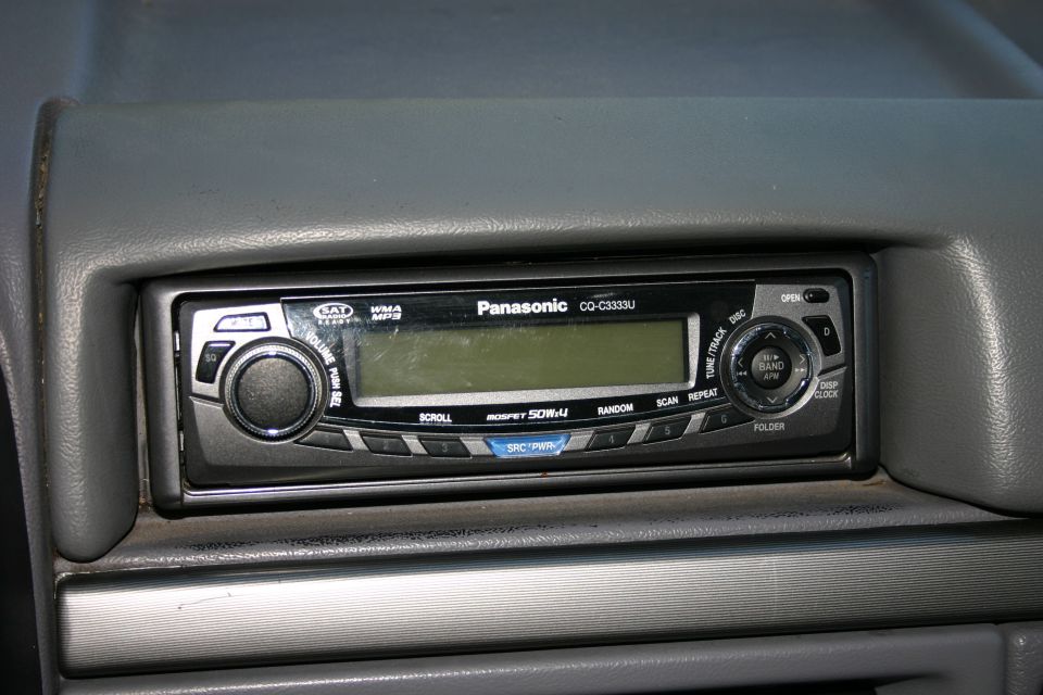 Panasonic CQ-C3333U car stereo head unit in gray dashboard