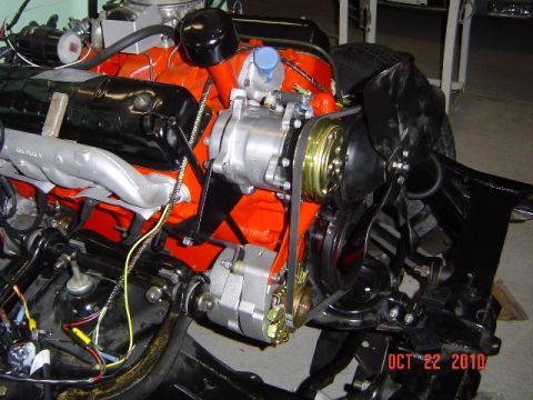 1956 Ford Fairlane - Close-up view of a V8 engine assembly, showing the engine block, accessories, and fan.