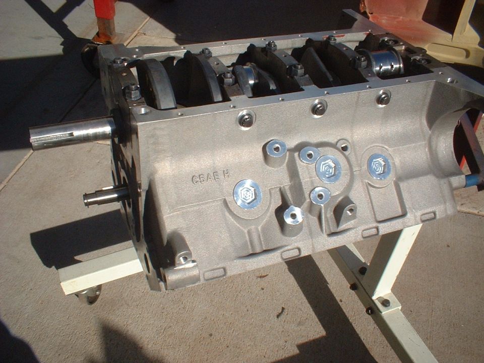 Engine block with crankshaft visible, on a stand