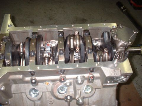 1965 Shelby Cobra - Close-up view of an engine block's internal components, including the crankshaft and connecting rods, with a visible part number.
