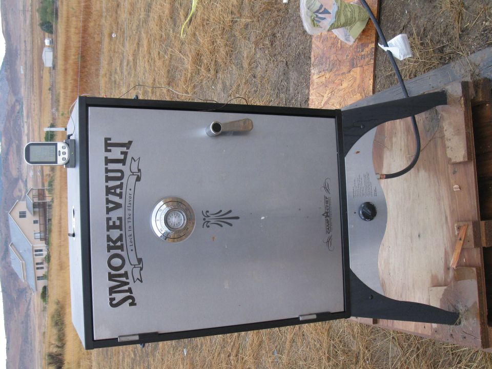 Camp Chef Smoke Vault food smoker cabinet outdoors on wooden boards