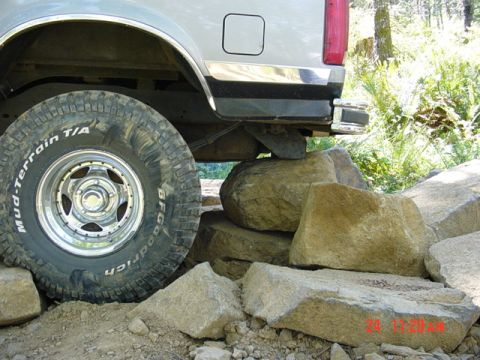 1989 Ford Bronco - 1989 Ford Bronco navigating a rocky trail.