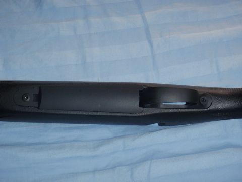 1991 Ford Bronco - A close-up view of a rifle's stock, focusing on the area around the trigger guard.