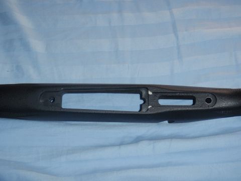 1991 Ford Bronco - A black gun stock is shown from the side, revealing internal channels for firearm components.