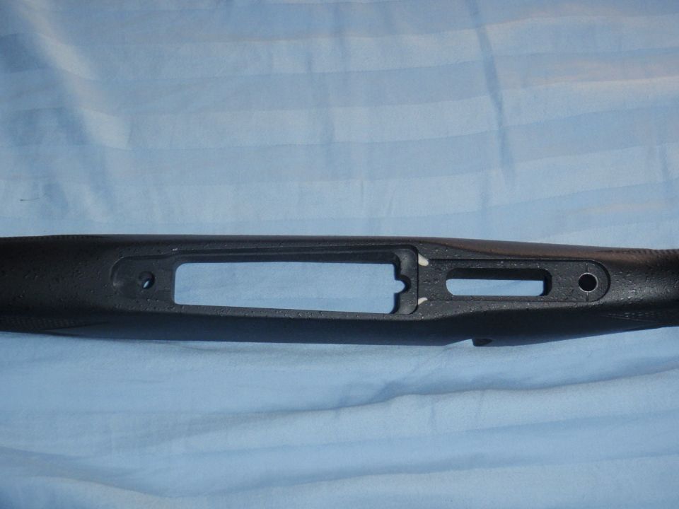 Black gun stock with internal cutouts for action and barrel