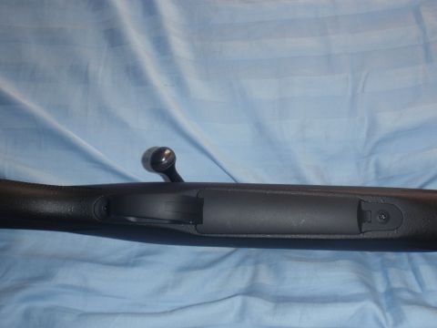 1991 Ford Bronco - Close-up view of a bolt action rifle receiver and bolt handle.