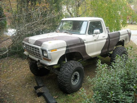 1979 Ford F-150 - Modified 1979 Ford F-150 pickup truck with large off-road tires and a two-tone camouflage paint job.