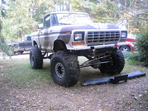 1979 Ford F-150 - This lifted 1979 Ford F-150 pickup features a camouflage paint scheme and oversized tires.