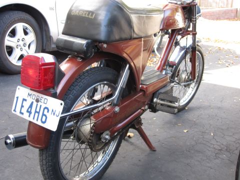 1981 Garelli Rally Sport - This moped has a license plate that says "Moped" and is parked next to a car.