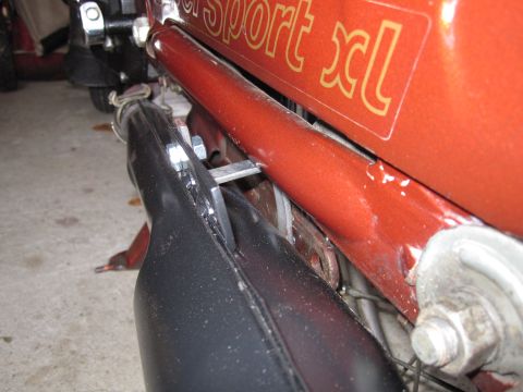 1981 Garelli Rally Sport - Close-up of an orange motorcycle frame with 'Sport xl' text visible on the side panel.