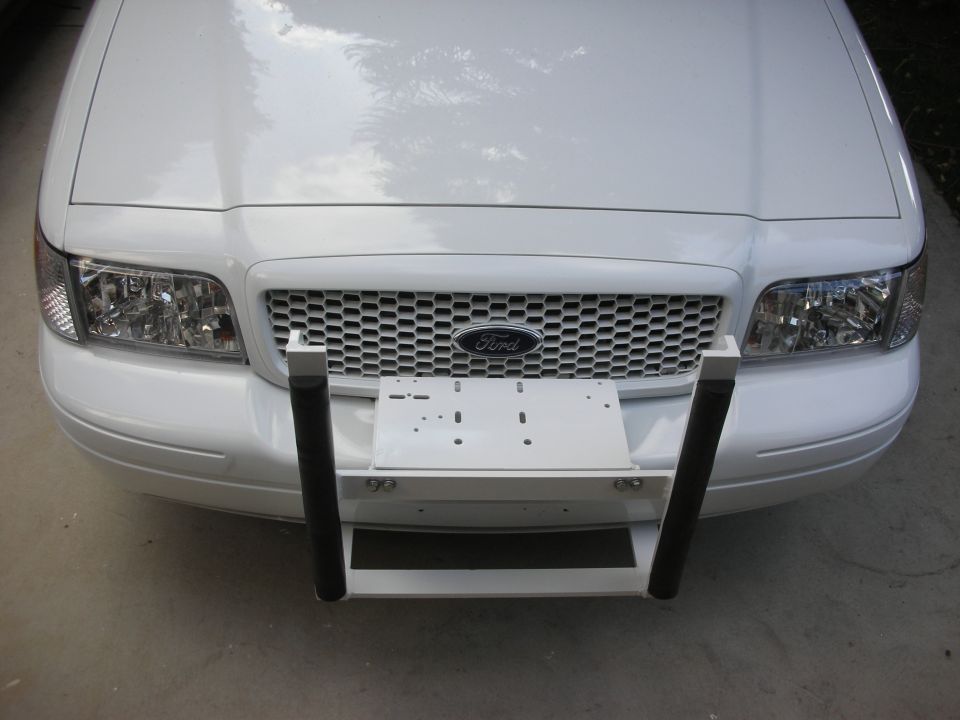 White Ford Crown Victoria front with push bumper and license plate mount