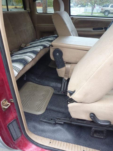 1997 Dodge 2500 - Rear interior of a 1997 Dodge 2500 pickup truck, the bench seat and center console.
