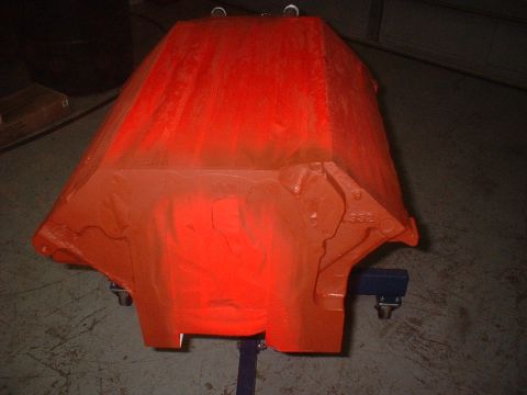 1964 Ford Galaxie - An orange engine block is shown on a stand, with visible casting marks.